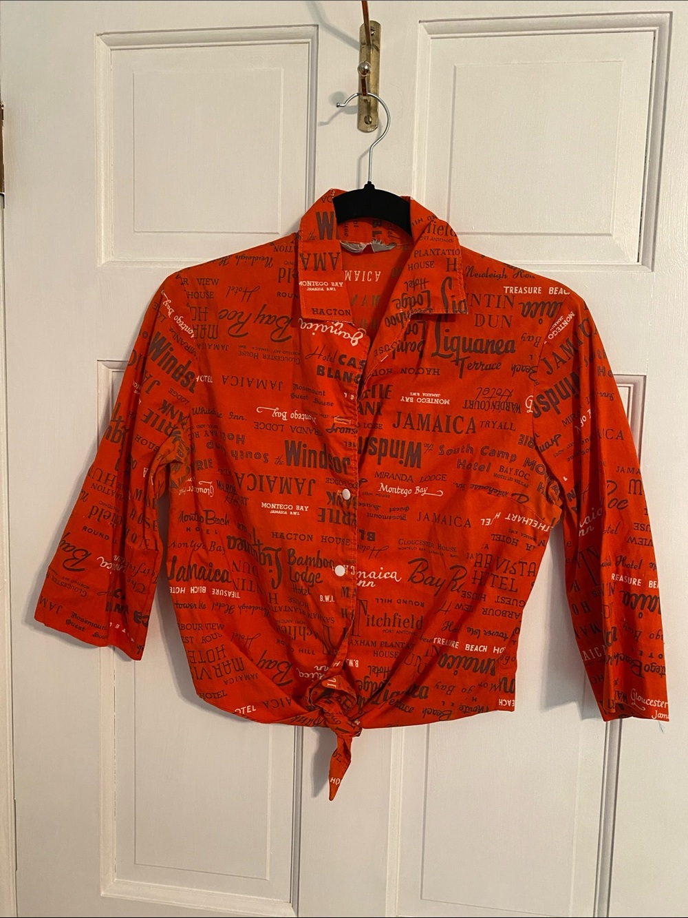 Button Front Tie-Waist Shirt in Bright Orange with Black Script
